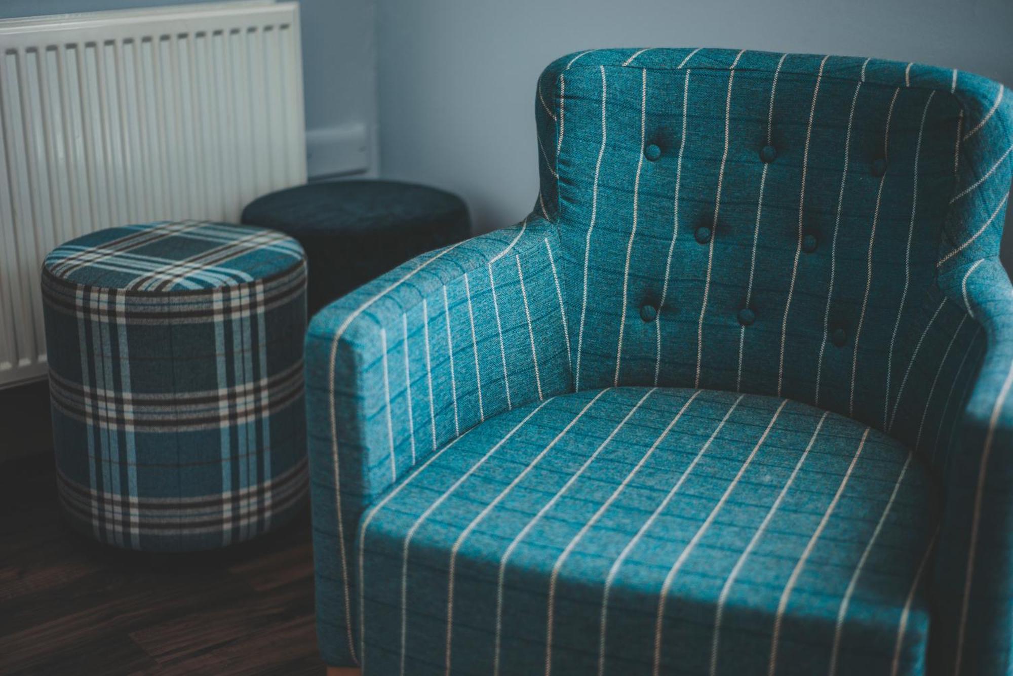 Oban Youth Hostel Exterior photo A chair and stool upholstered in tartan